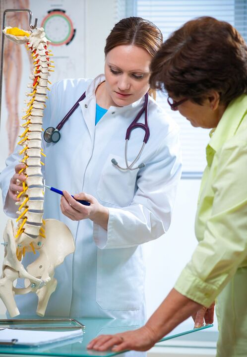 The doctor showed osteochondrosis of the spine on the model